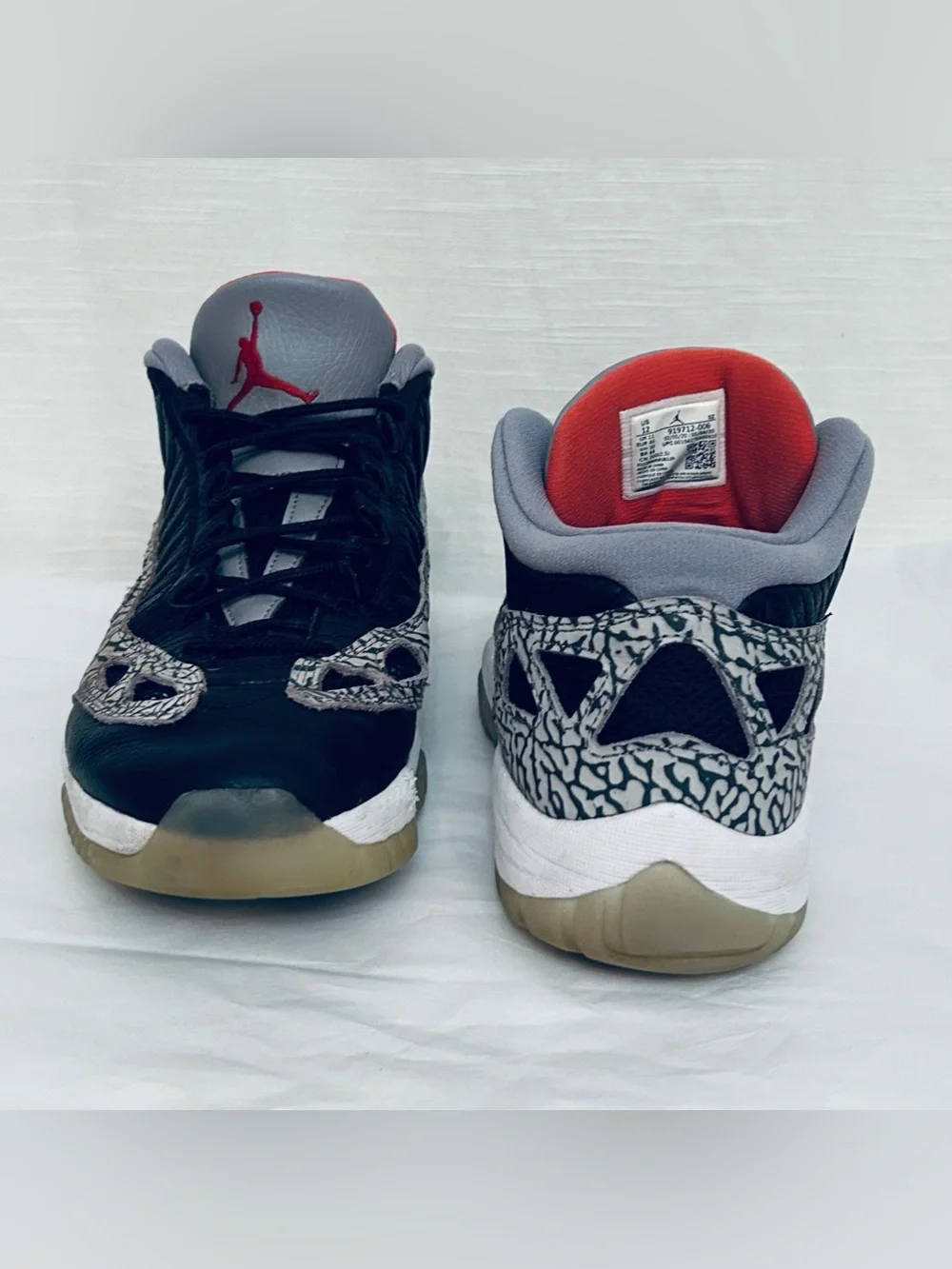 Air Jordan 11 Retro Low IE‎ Men's Black/Grey Sneakers with Red Jumpman Accents